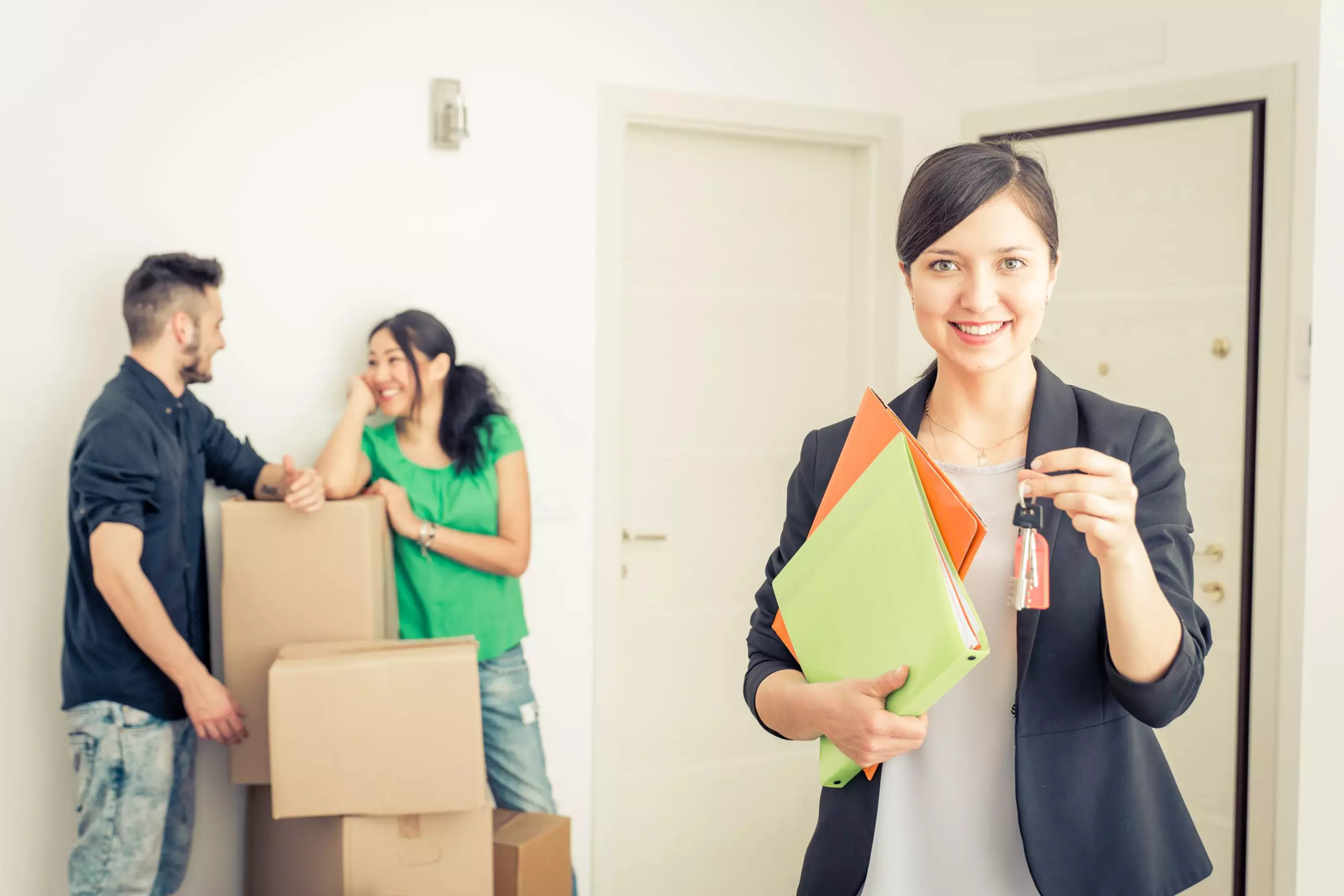 Realtor holding out keys to a new home